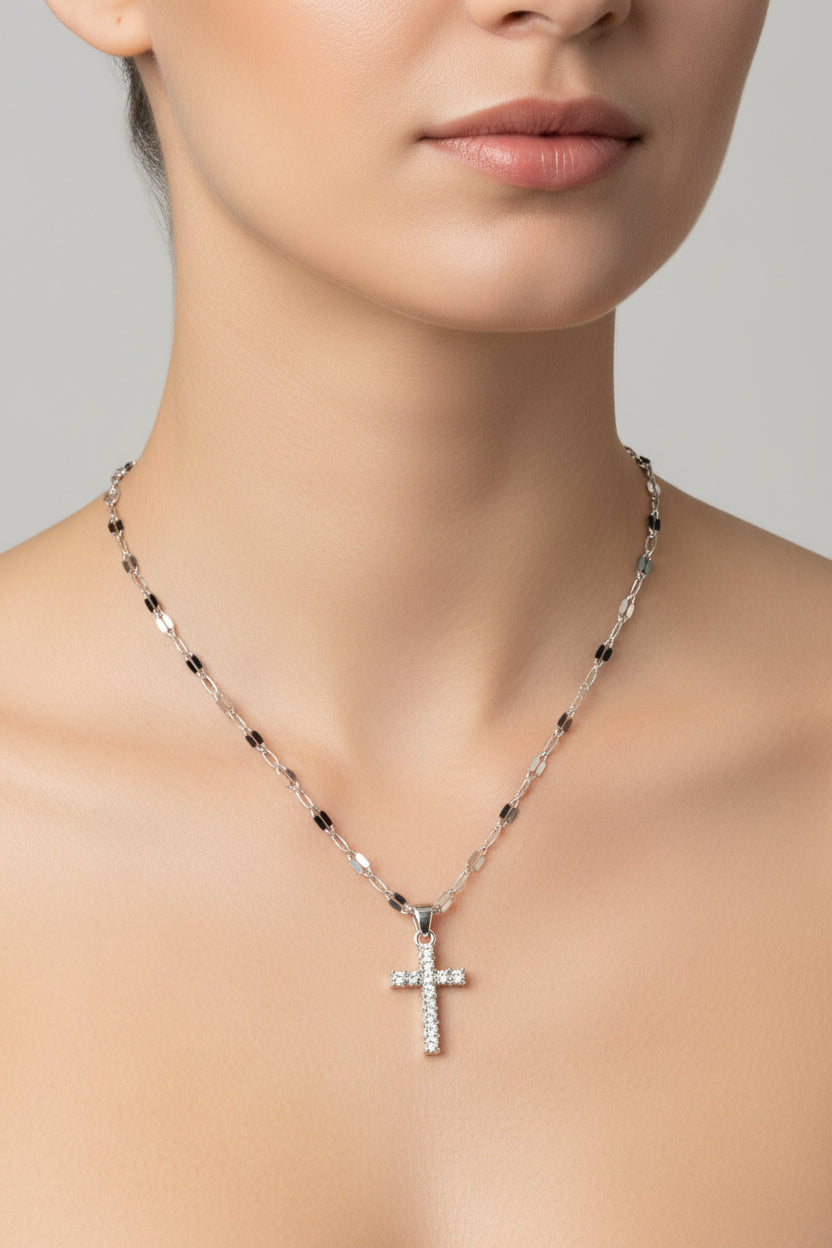 Necklace with a cross pendant on a model