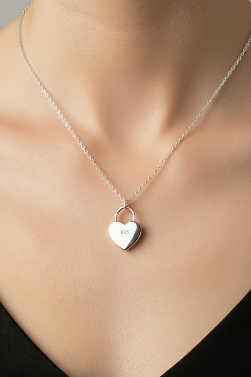 Necklace with a heart-shaped padlock pendant on a white model