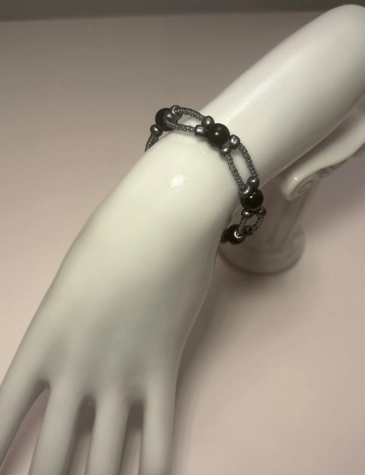 Handmade elasticated double strand bracelet in black glass pearl/grey seed bead by Majestic Gems by Sarah