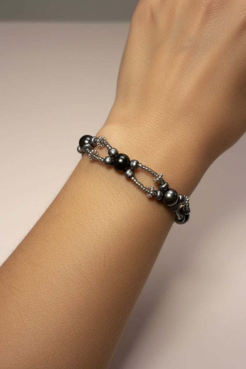 Black pearl bracelet on a model's arm 