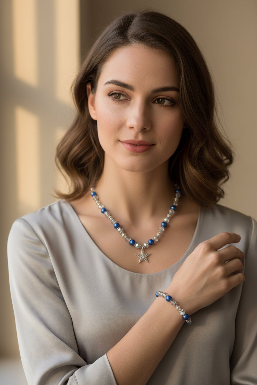 Necklace and bracelet set with blue and silver beads on a white model
