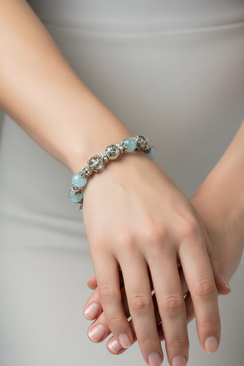 Bracelet with blue glass pearls on a model