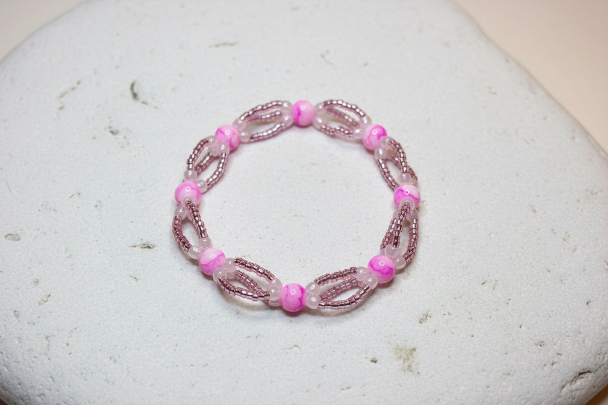 Handmade elasticated double strand bracelet in bright pink/white acrylic marbled bead by Majestic Gems by Sarah