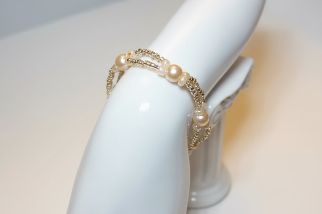 Handmade elasticated double strand bracelet in cream glass pearl by Majestic Gems by Sarah