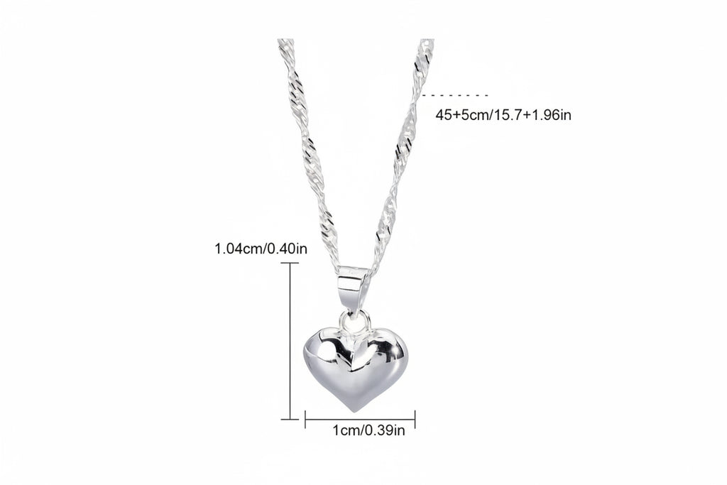 Adjustable heart necklace dangling on white background with measurements 