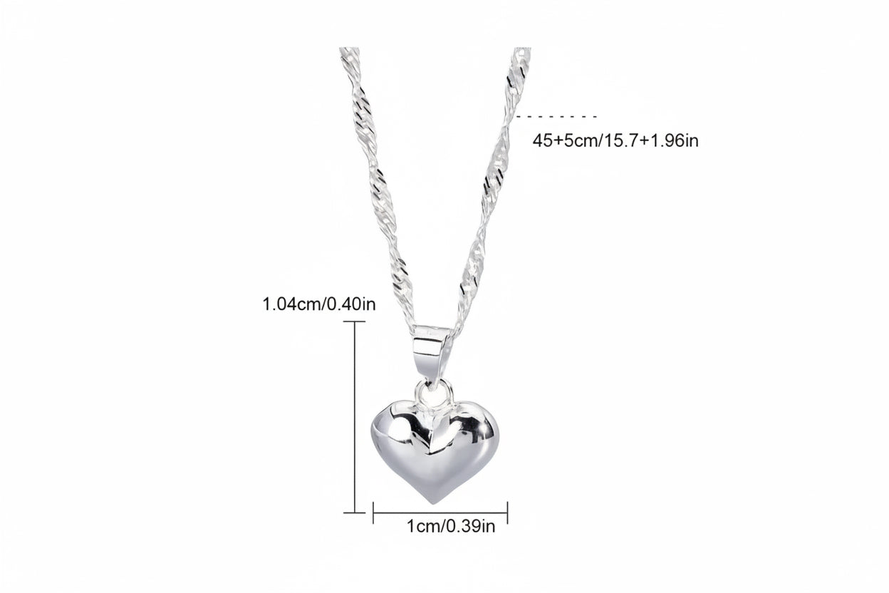 Adjustable heart necklace dangling on white background with measurements 