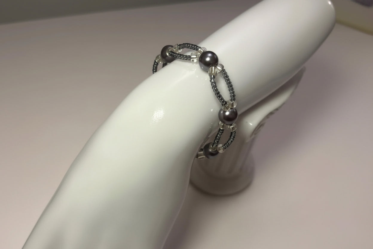 Handmade elasticated double strand bracelet in dark grey glass pearl by Majestic Gems by Sarah