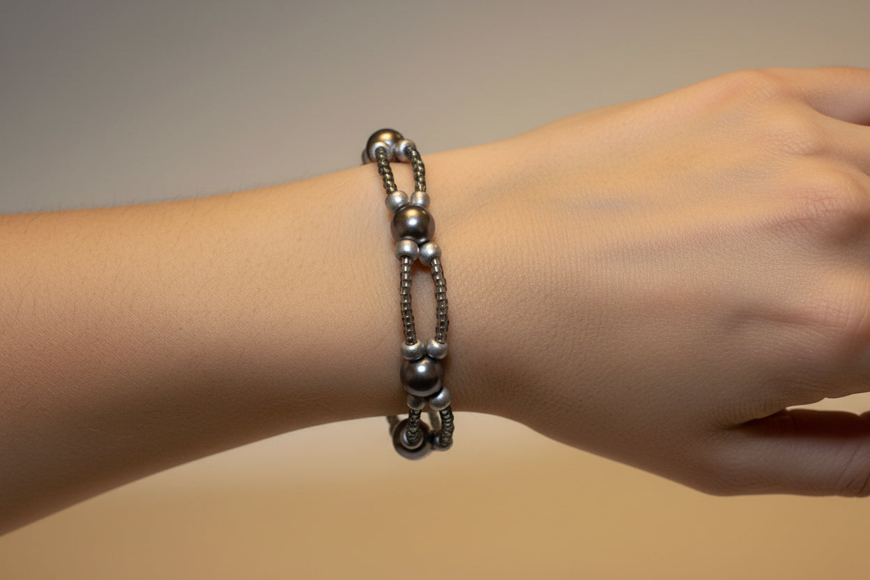 Handmade elasticated double strand bracelet in dark grey glass pearl/silver seed bead by Majestic Gems by Sarah