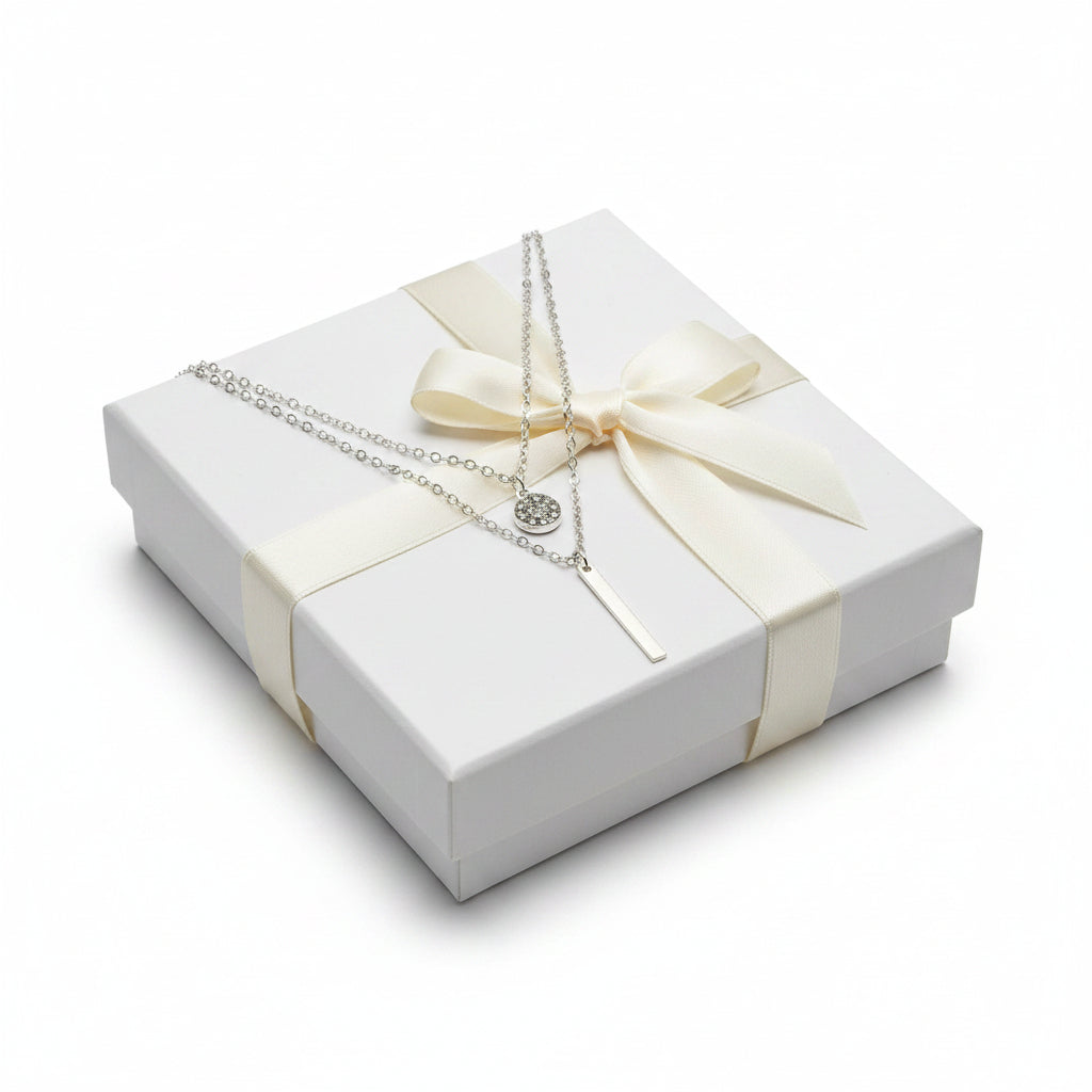 Silver necklace set pendants on a gift box