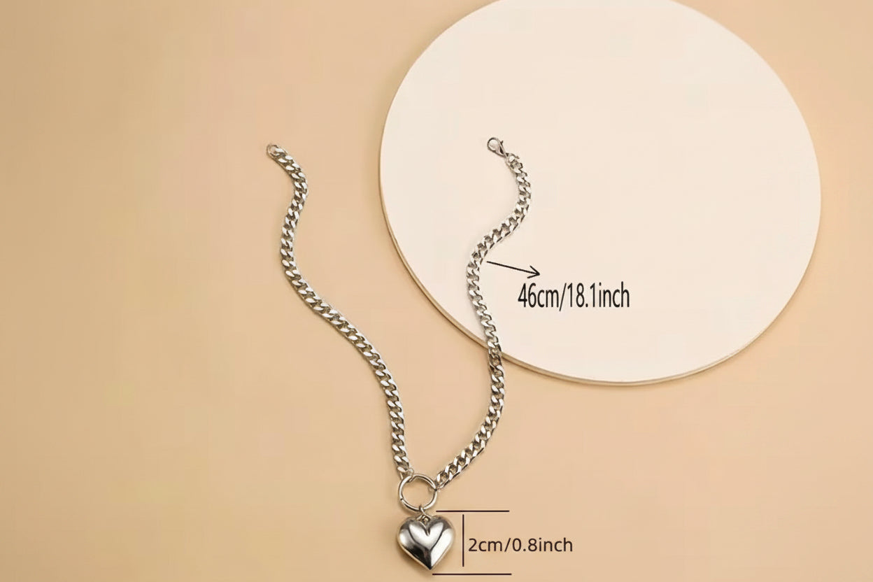 Full view of choker heart necklace with measurements on white plate