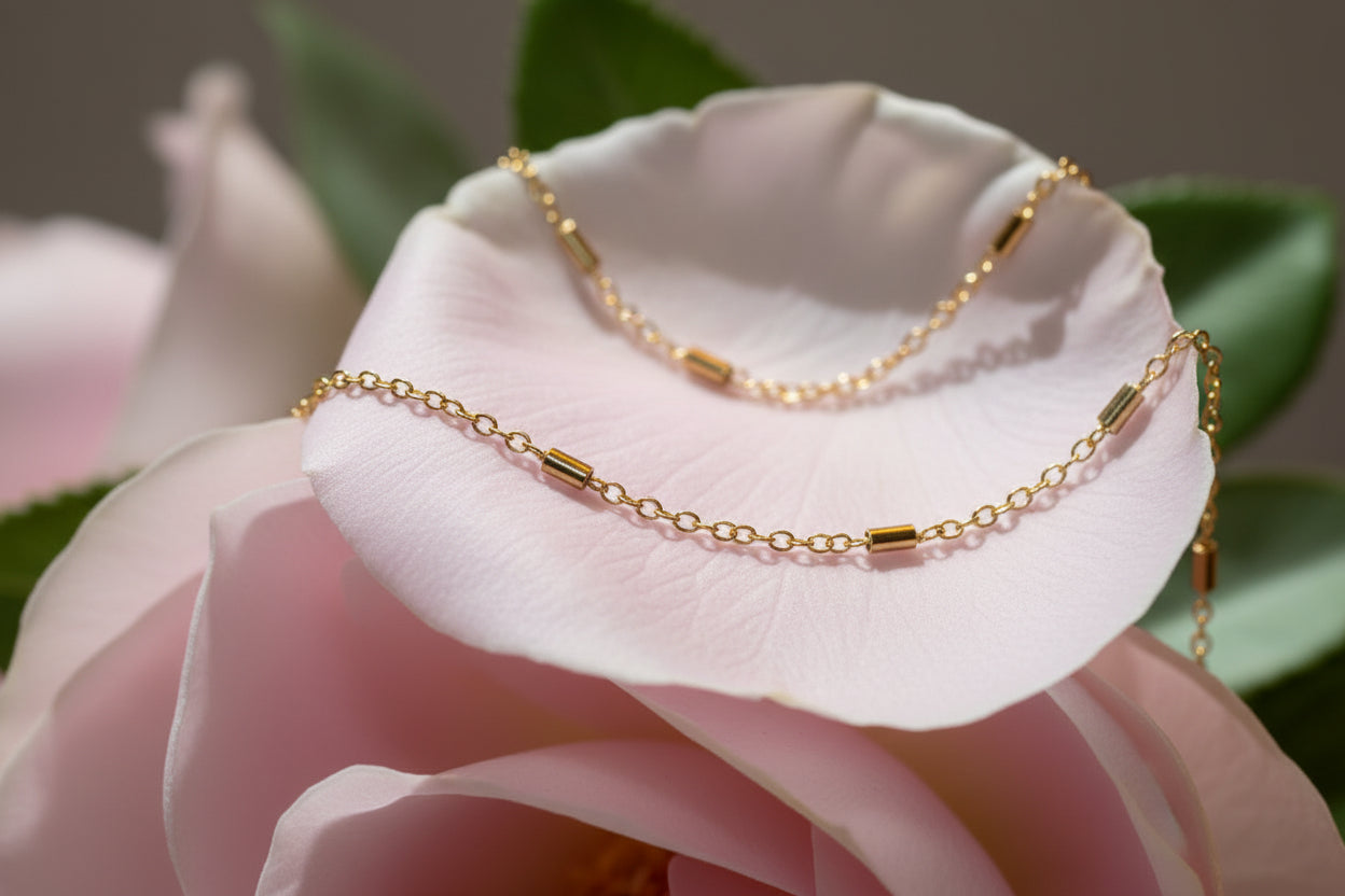 Gold bracelet on a large pale pink petal