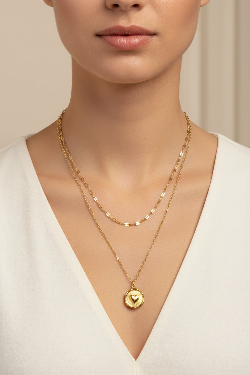 Gold necklace with a pendant on a white model