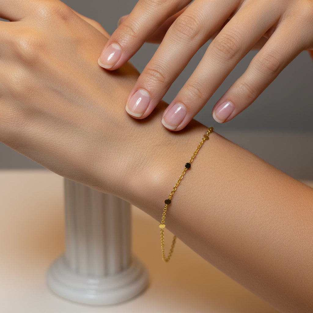 Gold bracelet with beads on a model
