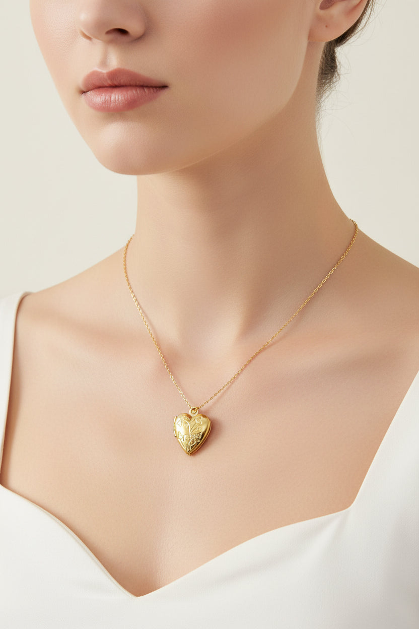 Gold heart-shaped locket necklace on a model