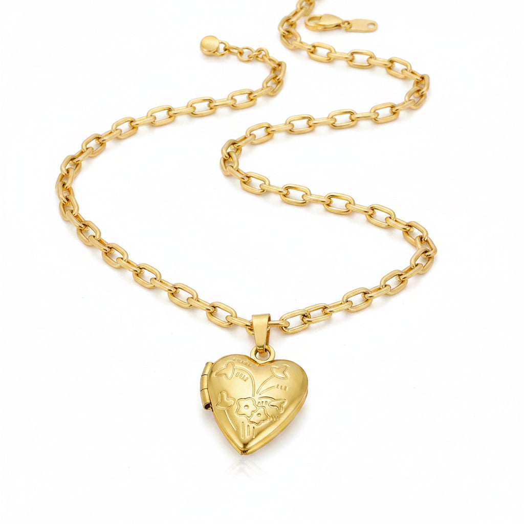 Gold heart-shaped flower locket on a chain link necklace 