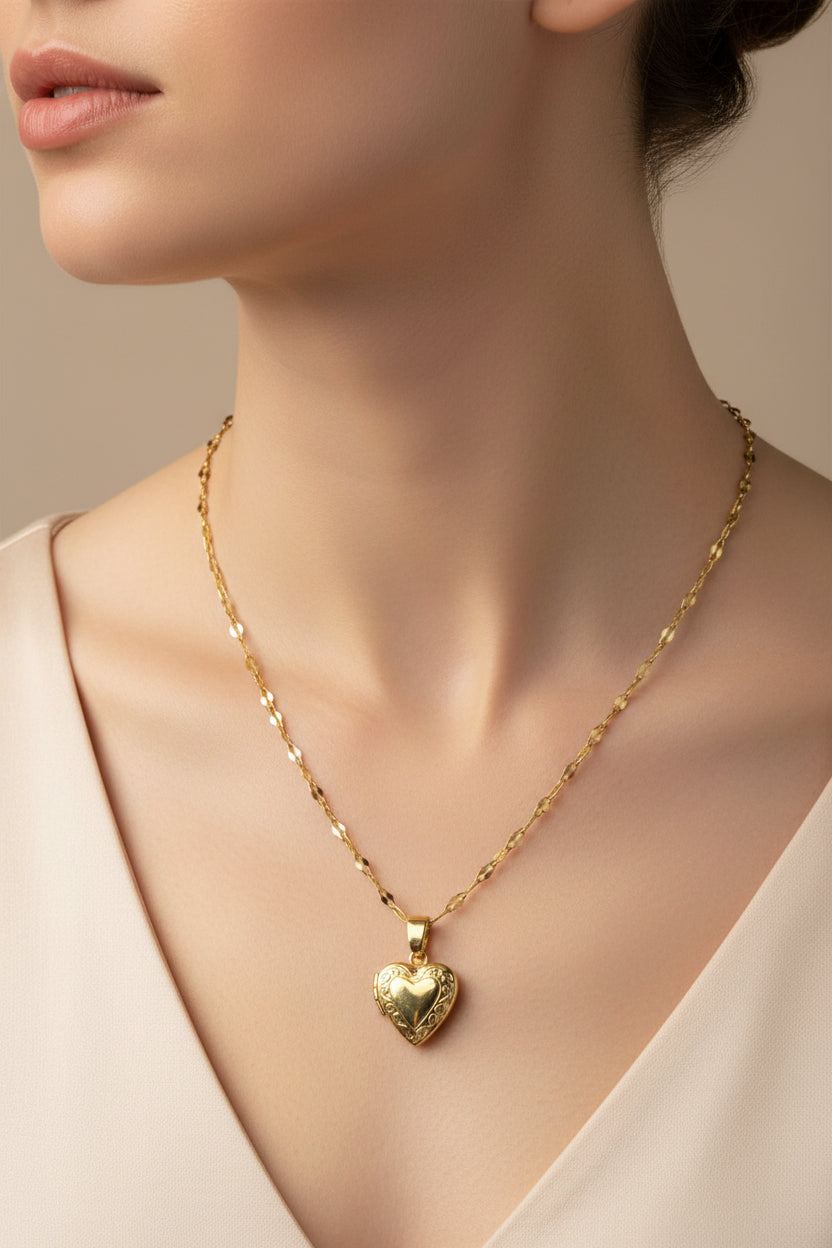 Gold brass heart-shaped locket on a lip chain necklace on a model