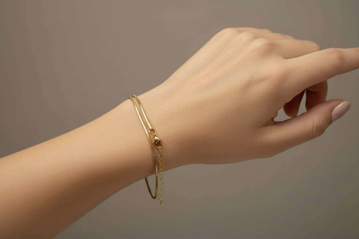 Gold necklace on a white model's arm