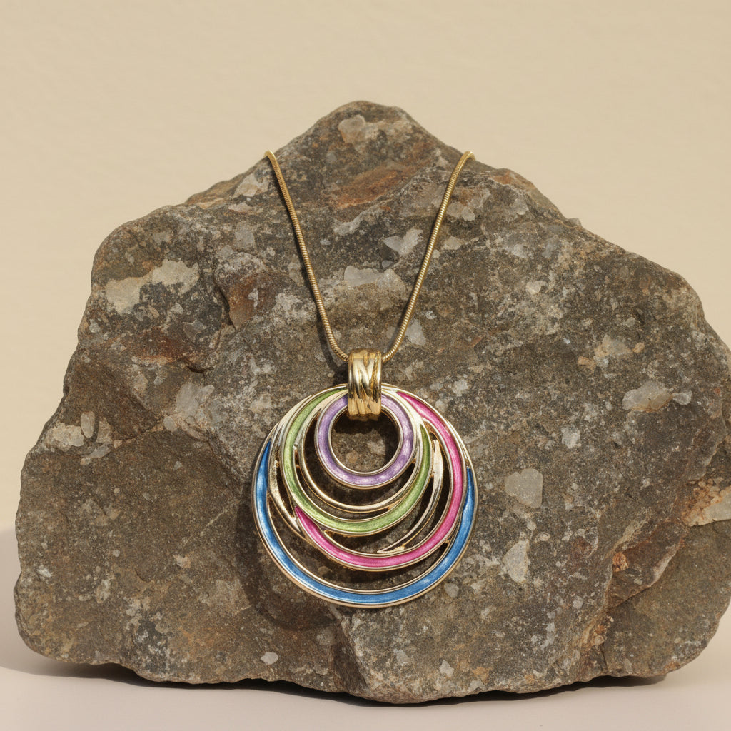 Necklace with colorful circular pendants on a large stone 