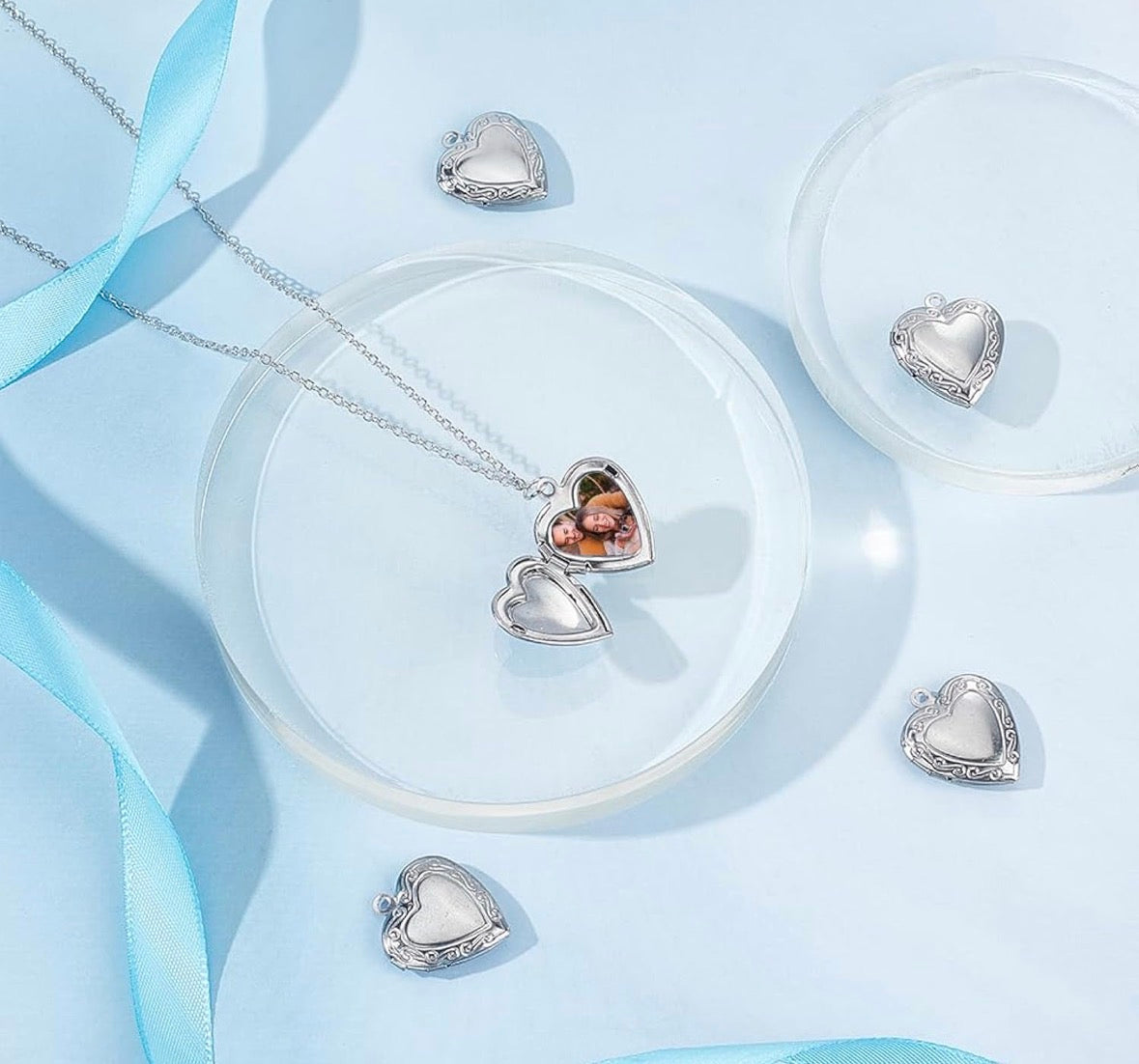 Heart-shaped locket set on a light blue background