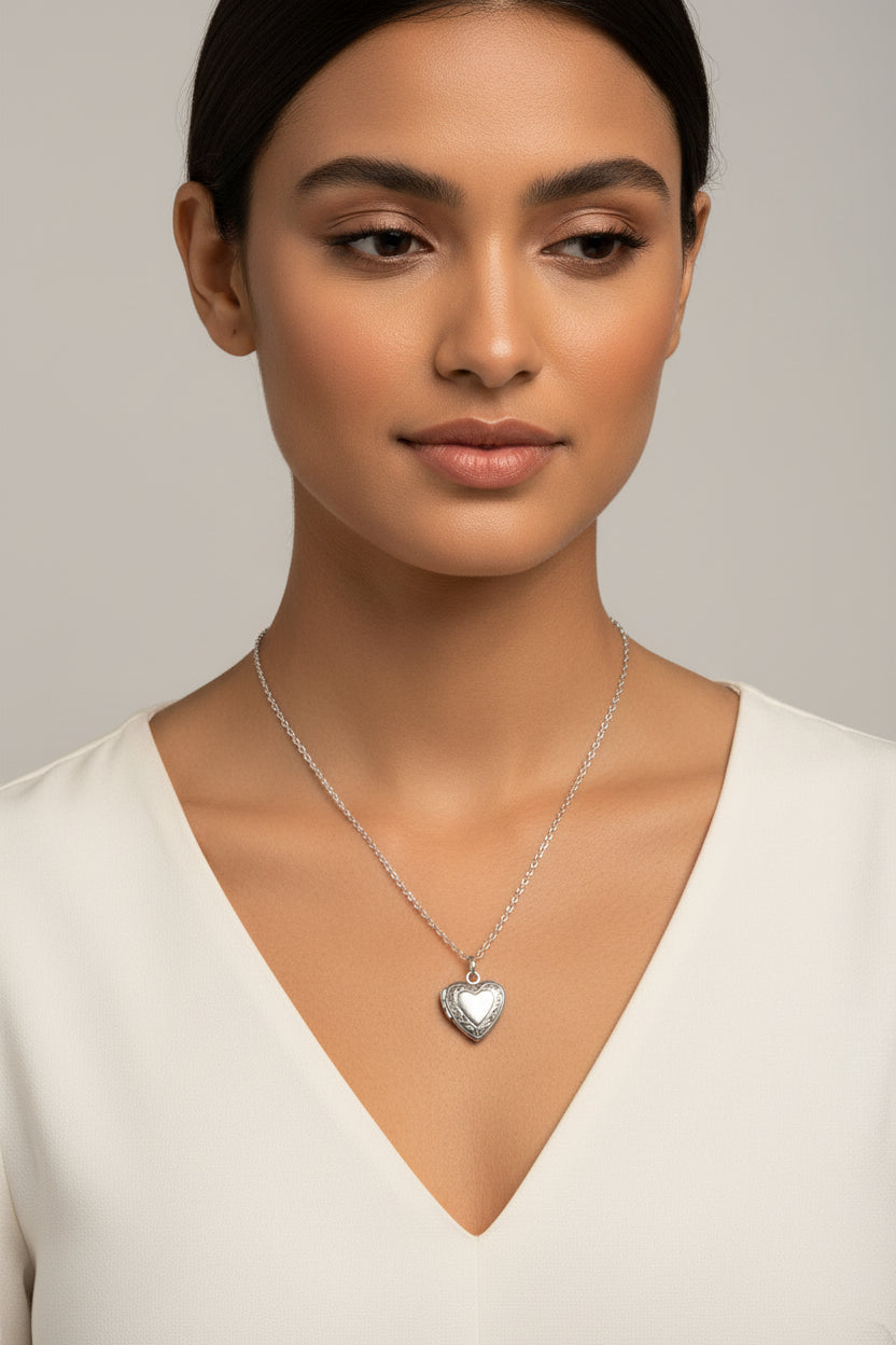 Silver heart-shaped pendant necklace on a model