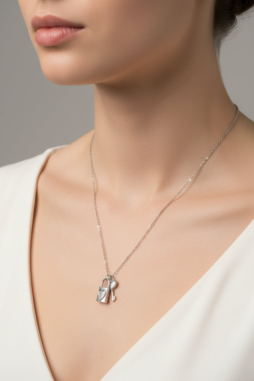 Silver necklace with a heart-shaped pendant on a model