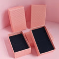 Pink gift boxes on a pink background