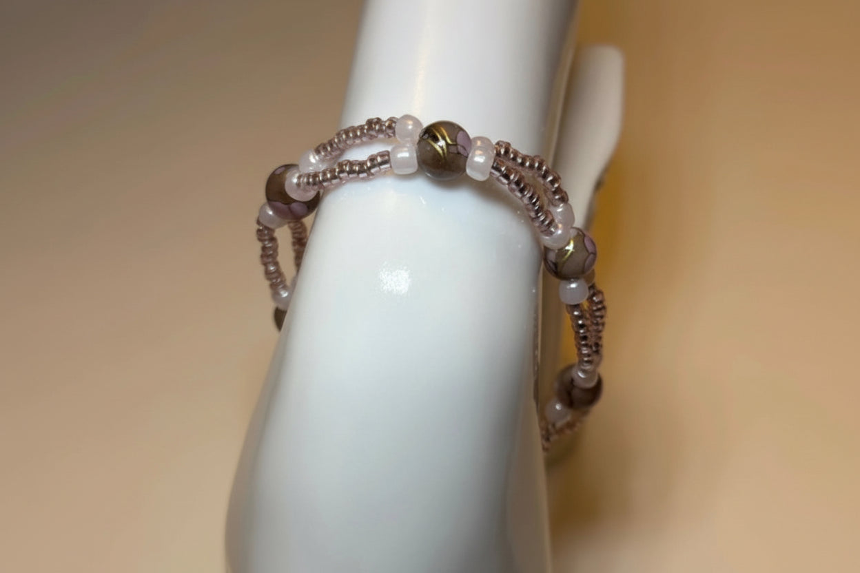 Handmade elasticated double strand bracelet in pink marbled glass pearl by Majestic Gems by Sarah