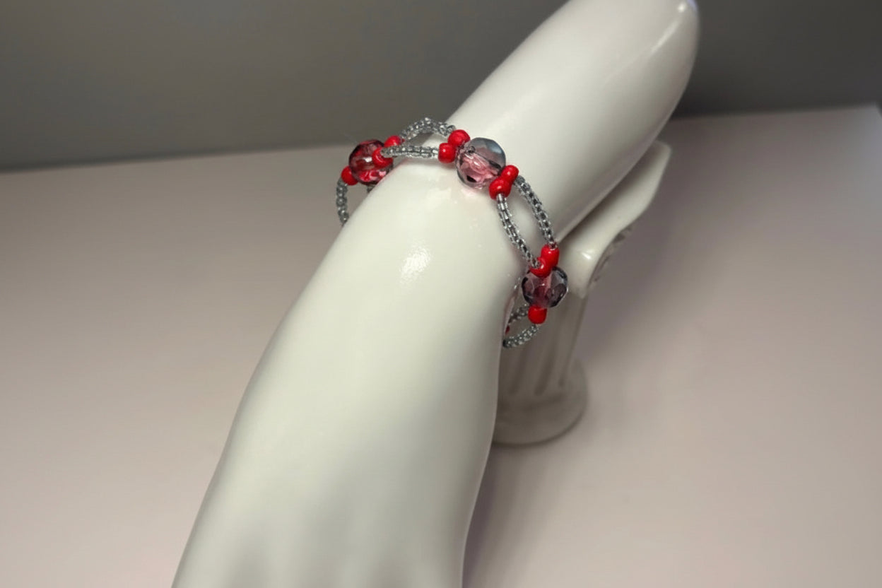 Handmade elasticated double strand bracelet in red/clear glass bead by Majestic Gems by Sarah
