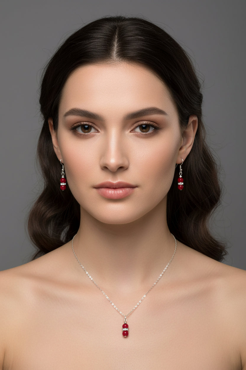 Jewelry set with red beads on a model