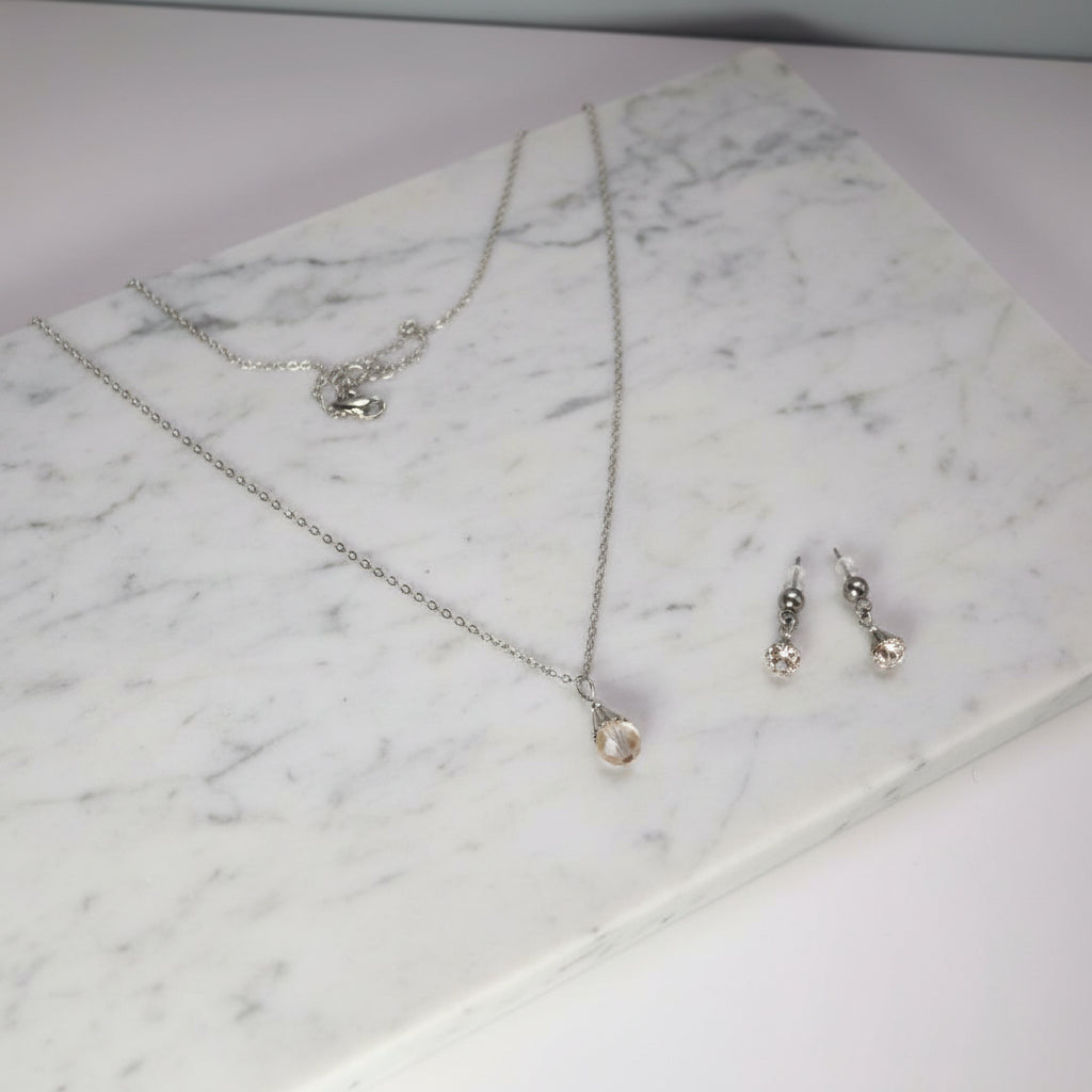 Jewelry set with necklace and earrings on a model