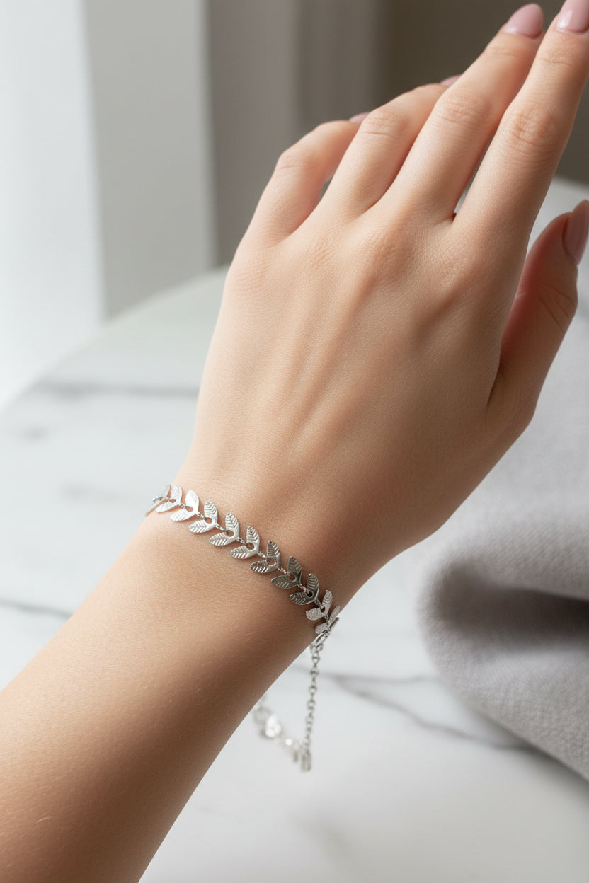 Silver leaf bracelet on a model's arm