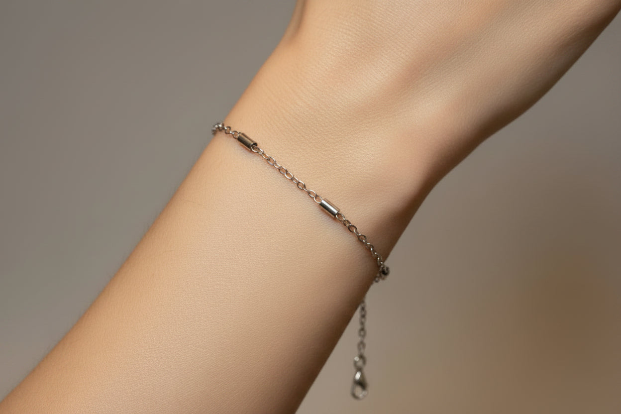Silver chain bracelet on a model's arm 