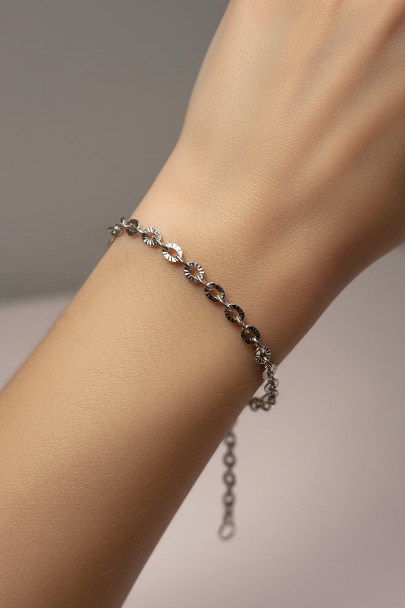 Silver chain bracelet on a model's arm