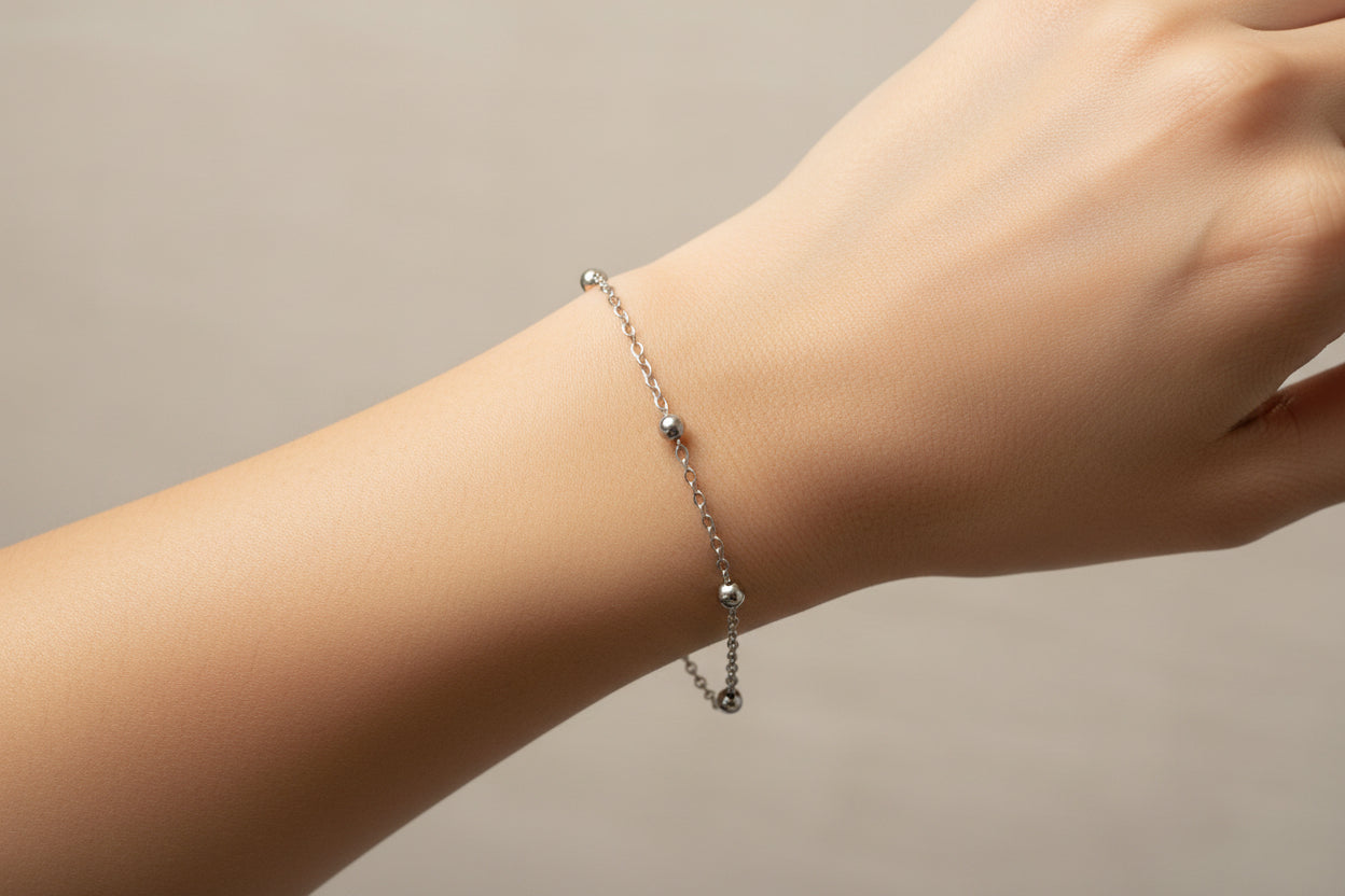 Silver chain bracelet on a model's arm 