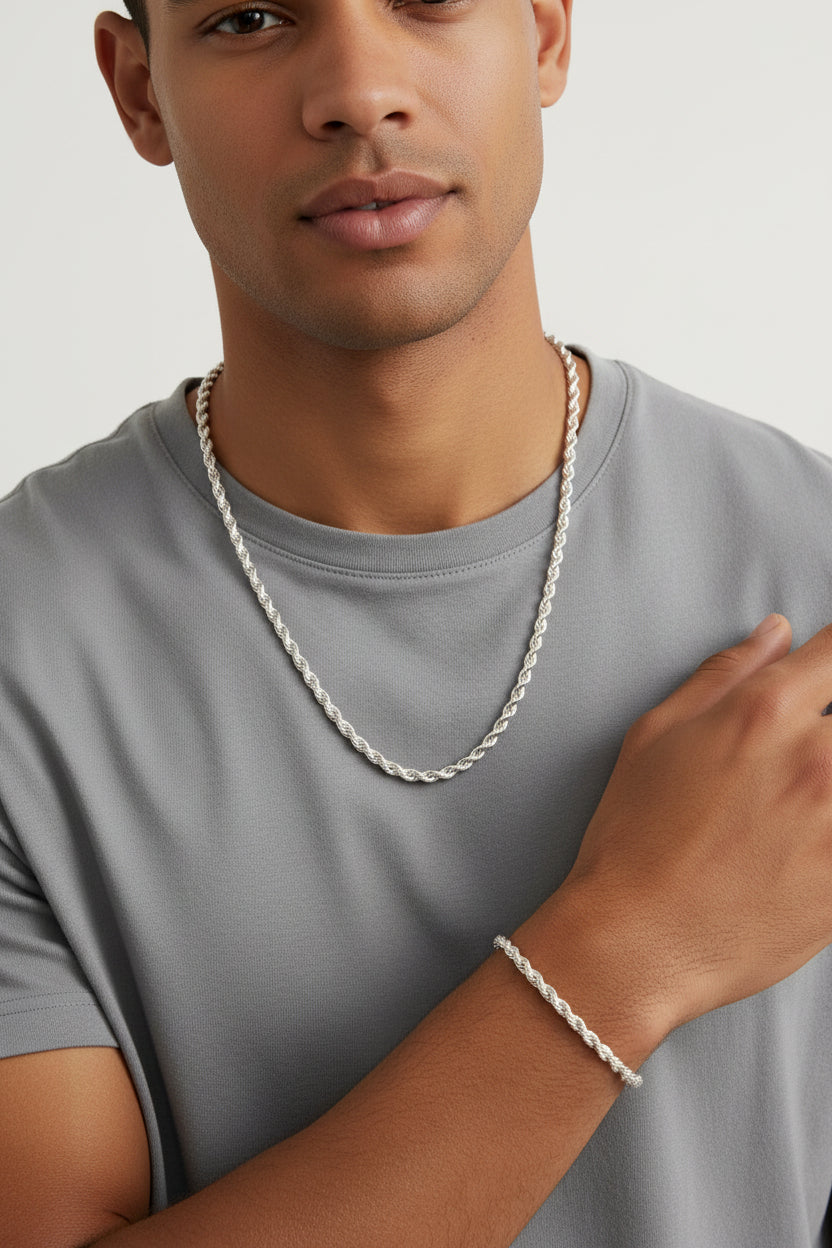 Silver twisted chain necklace and bracelet set displayed on a male model 