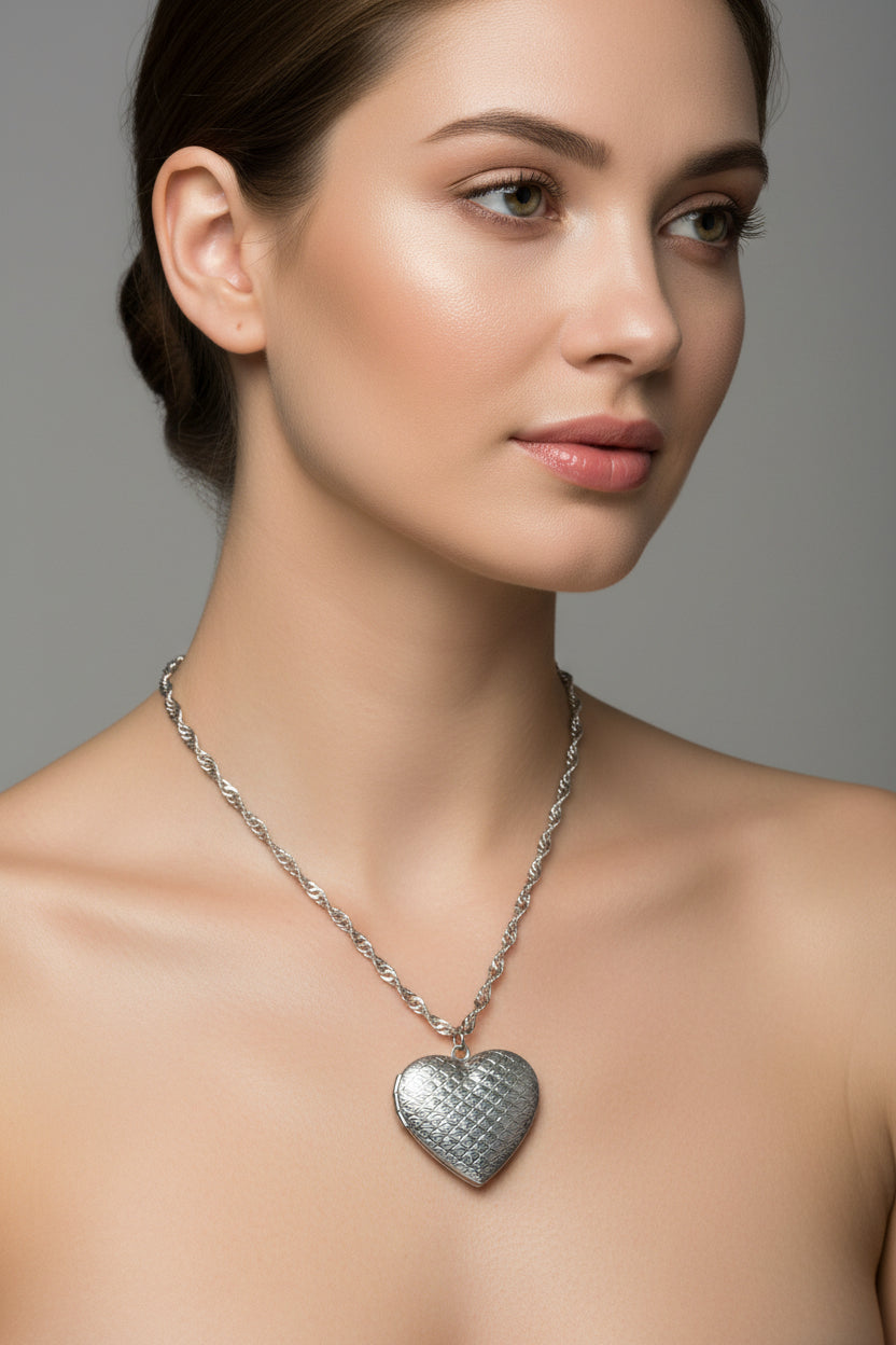 Silver heart-shaped pendant necklace on a model