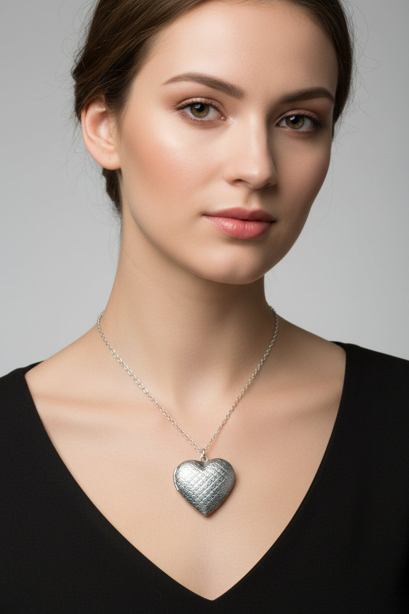 Silver heart-shaped pendant necklace on a model