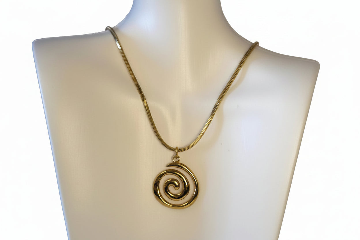 Gold stainless steel spiral pendant necklace on mannequin 