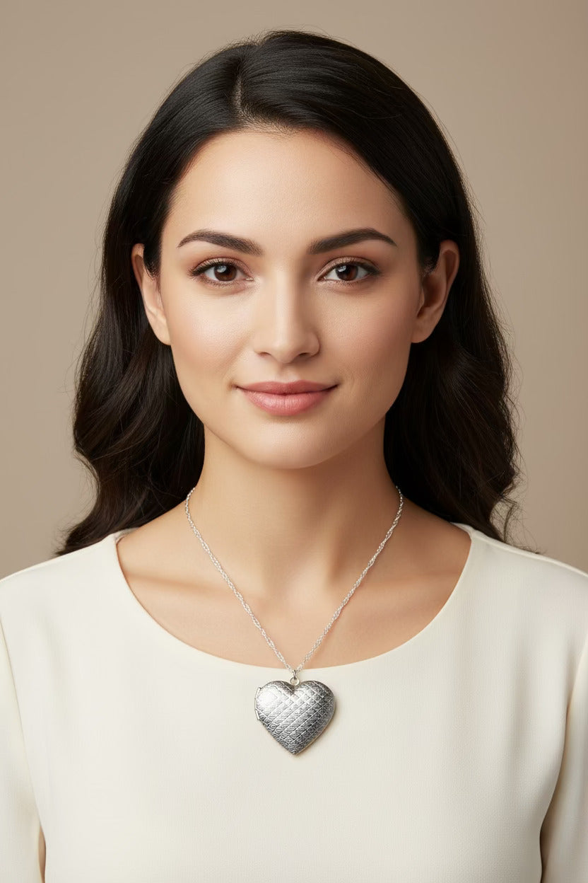 Woman wearing a silver heart-shaped necklace on a model