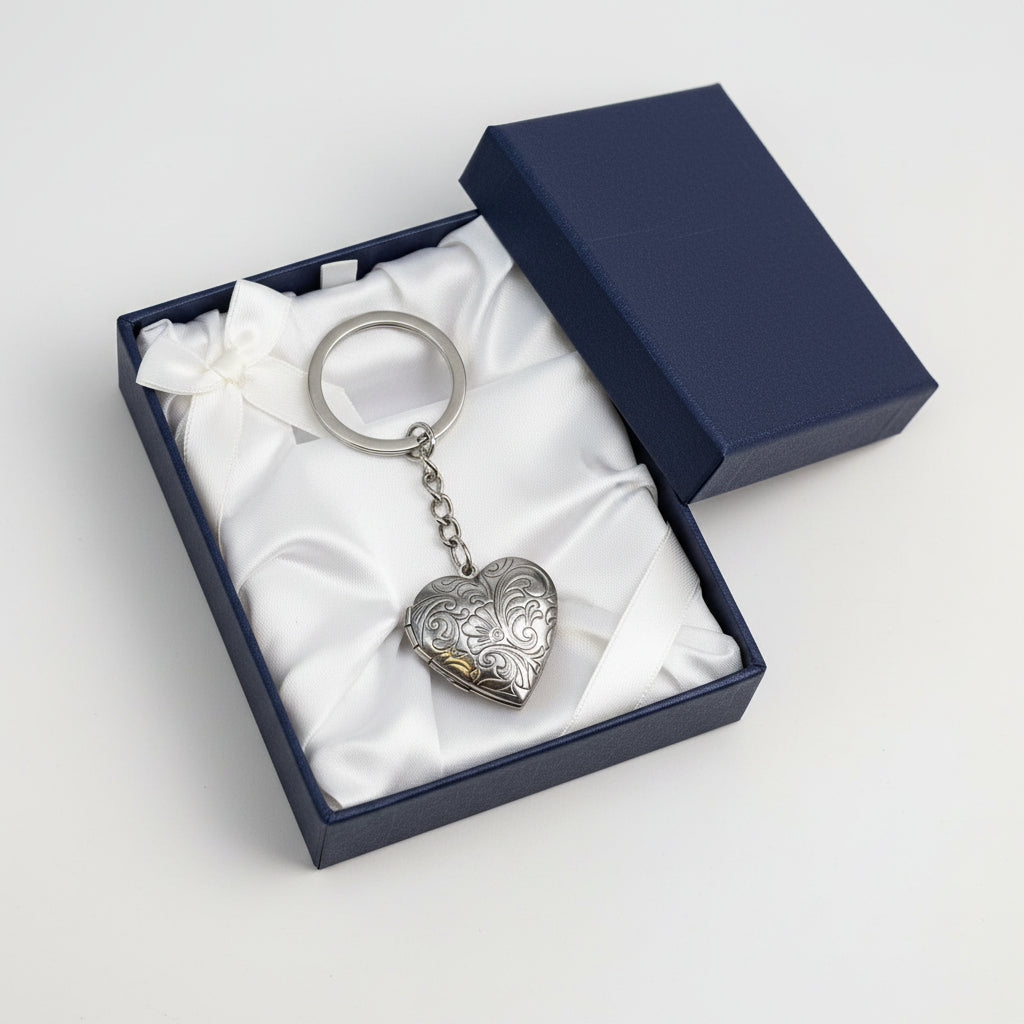 Silver heart-shaped keychain in a blue gift box