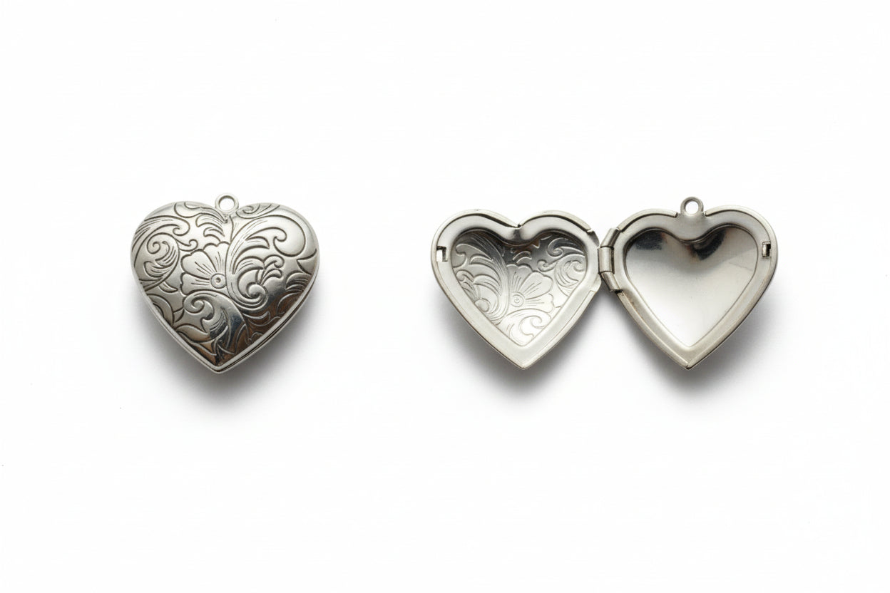Heart-shaped silver locket on a light gray background