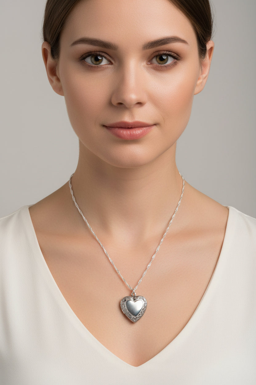 Heart-shaped silver locket on water wave necklace on a model