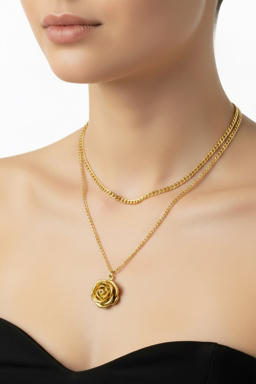 Gold necklace with a flower pendant on a model