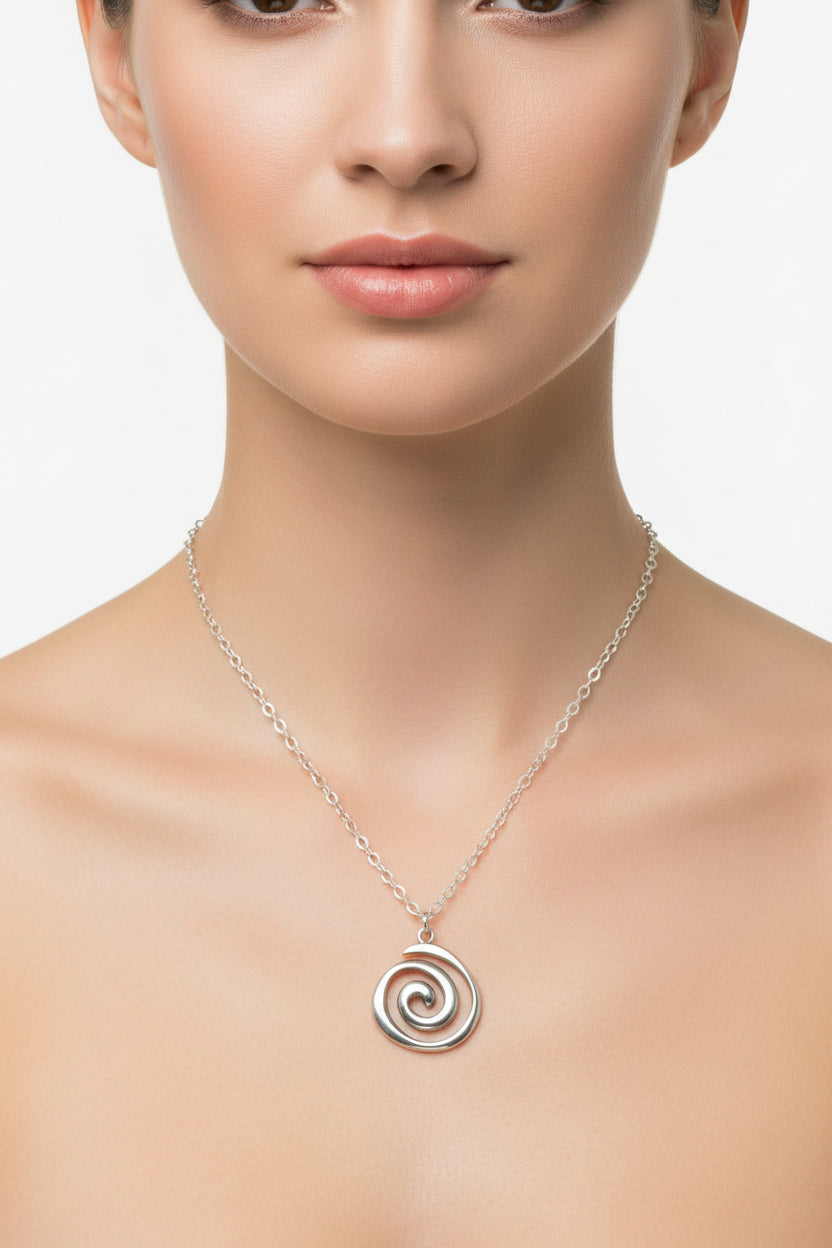Silver spiral pendant necklace on a model