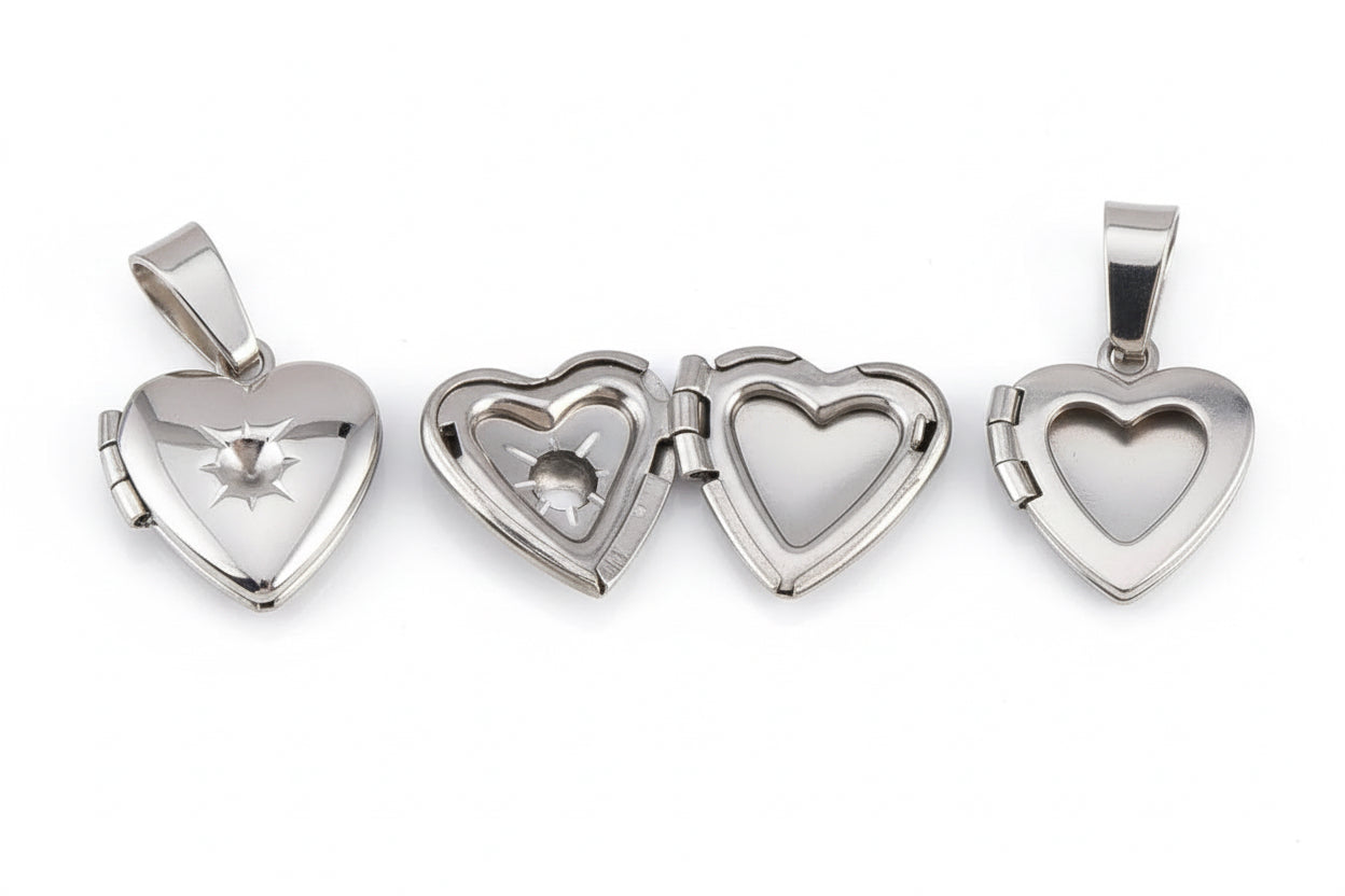 Set of silver heart-shaped pendants on a white background