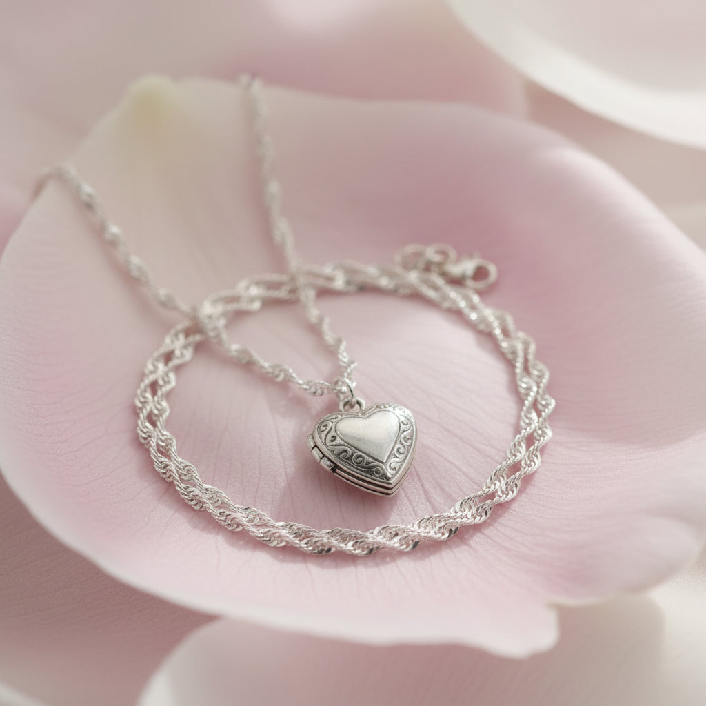 Silver heart-shaped locklet necklace on a large petal