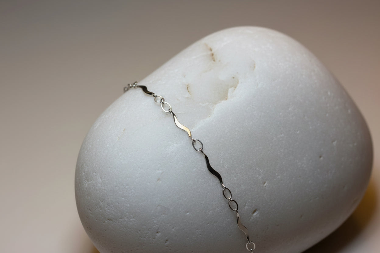 Silver bracelet on a large white stone