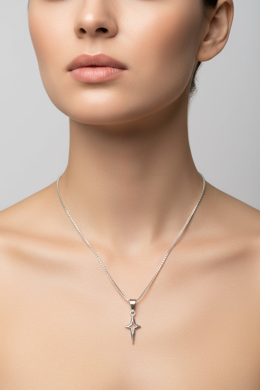 Silver box chain necklace with a star pendant on a model