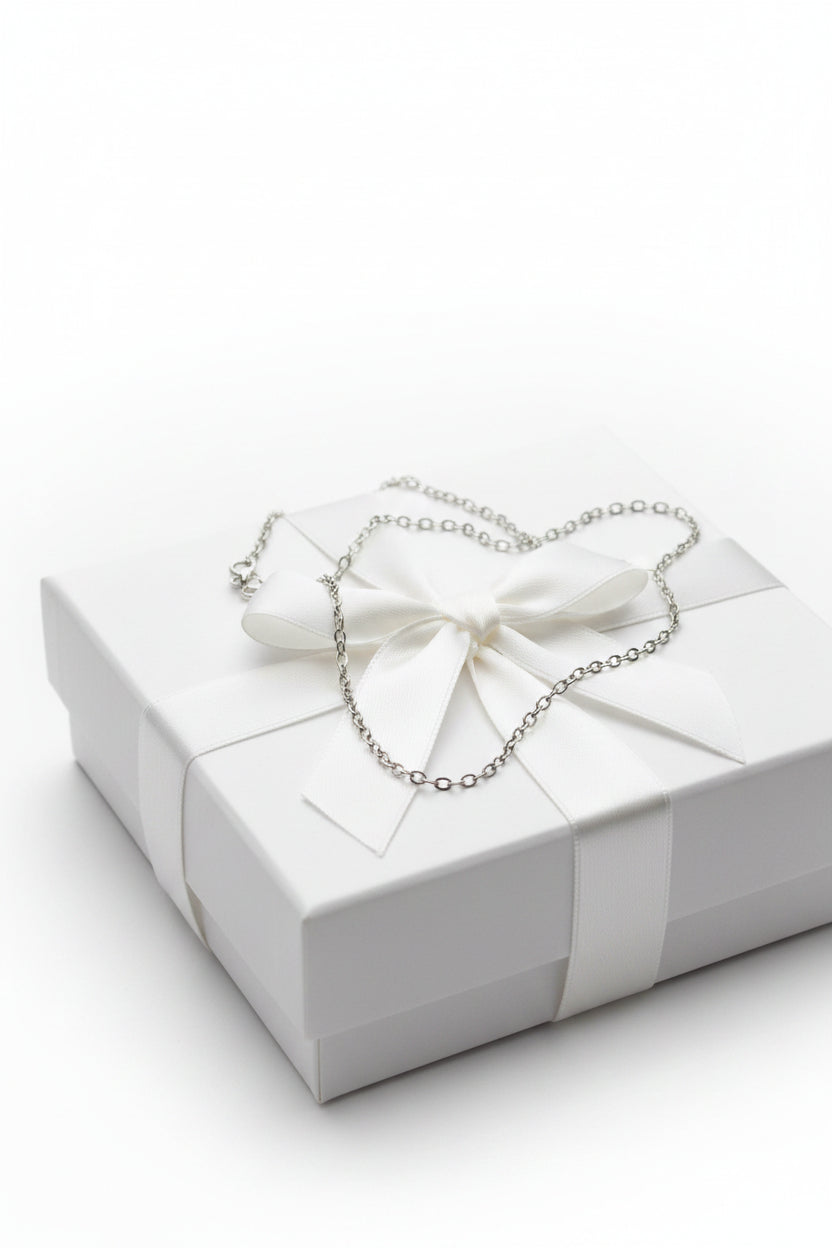 Silver chain necklace on a gift box