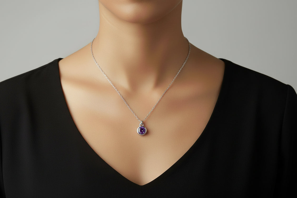 Necklace with a purple gemstone pendant on a model